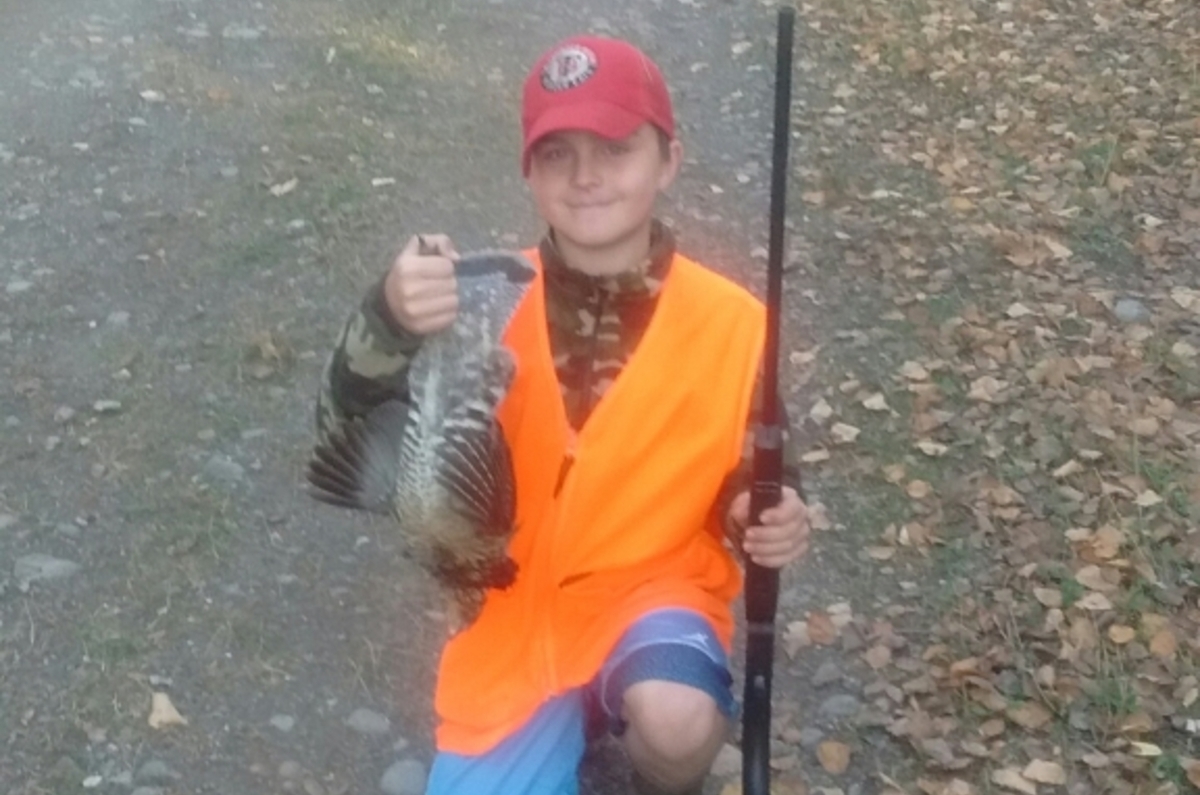 small boy with grouse